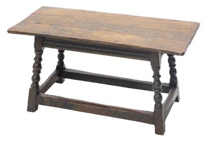 Lot 988 - An oak low table, with a plank top on turned...