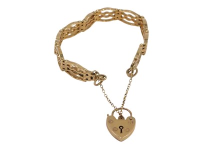 Lot 75 - A 9ct gold four bar gate bracelet, on a heart...