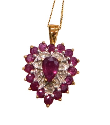 Lot 76 - A 9ct gold ruby and diamond pendant of heart...