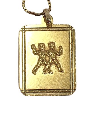 Lot 77 - A rectangular pendant, embossed with two putti,...
