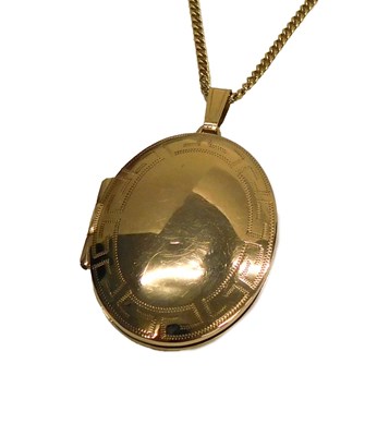 Lot 72 - A 9ct gold oval photo locket, with engraved...