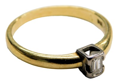 Lot 524 - An 18ct gold and diamond solitaire ring, the...