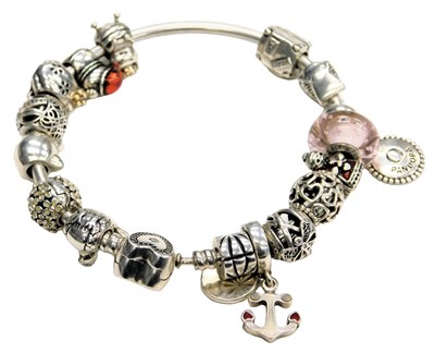 Lot 578 - A Pandora bangle, with sixteen charms, on a...