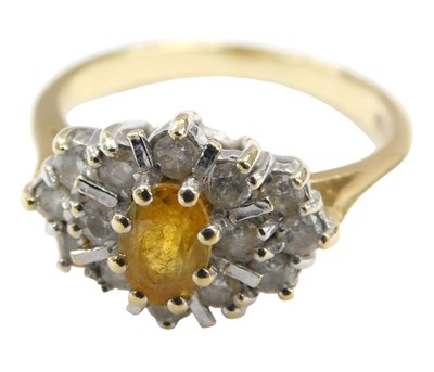 Lot 568 - An 18ct gold yellow sapphire and diamond set...