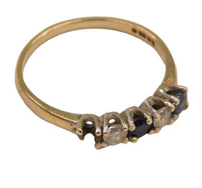 Lot 590 - A 9ct gold sapphire and CZ five stone ring,...
