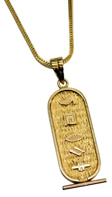 Lot 602 - An Egyptian pendant, of oval form, embossed...