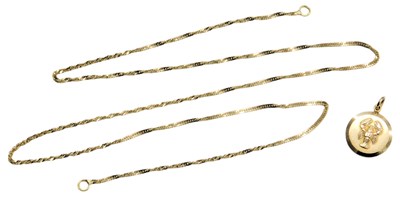 Lot 599 - A 9ct gold Cancer astrological pendant, on a...