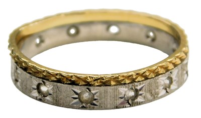 Lot 608 - An 18ct two colour gold and CZ set wedding...