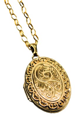 Lot 601 - A 9ct gold oval photo locket, with engraved...