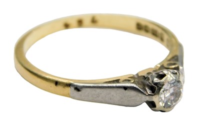 Lot 612 - An 18ct two colour gold and diamond solitaire...