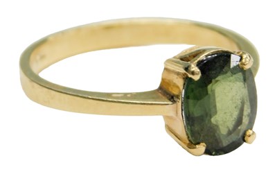 Lot 613 - A green single gemstone set ring, possibly a...