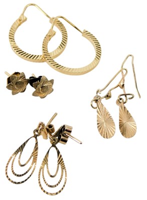 Lot 626 - A pair of hoop earrings, yellow metal stamped...