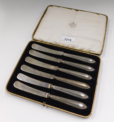 Lot 2219 - A set of six silver handled dessert knives, in...