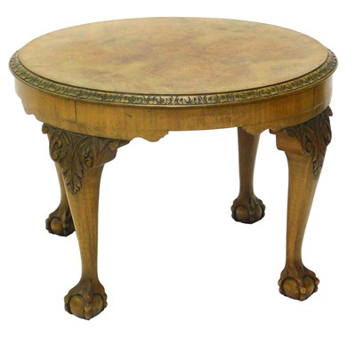 Lot 1078 - A walnut coffee table, the circular quarter...