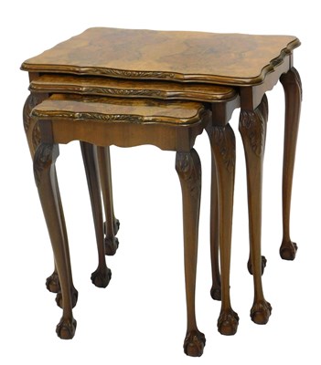 Lot 1006 - A walnut and figured walnut nest of three...
