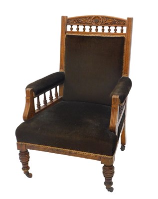 Lot 1007 - A Victorian oak armchair, with carved and...
