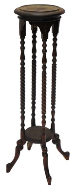 Lot 1024 - A mahogany plant stand, on turned and spirally...