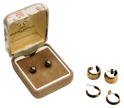 Lot 617 - A pair of 9ct gold hoop earrings, a further...
