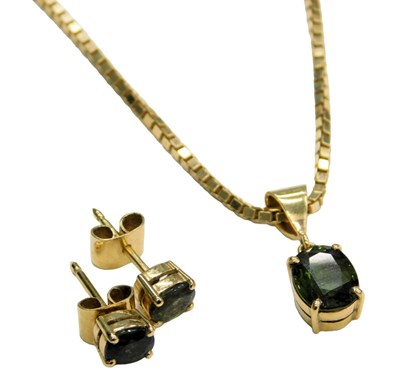 Lot 623 - A green tourmaline pendant, the oval cut stone...