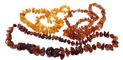 Lot 585 - A string of rough hewn amber beads, of varying...