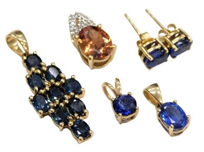 Lot 758 - Four 9ct gold and gem set pendants, one...