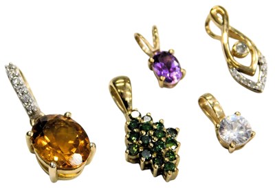 Lot 761 - Five 9ct gold and gem set pendants, one...