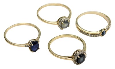 Lot 719 - Four 9ct gold and gem set rings, set with...
