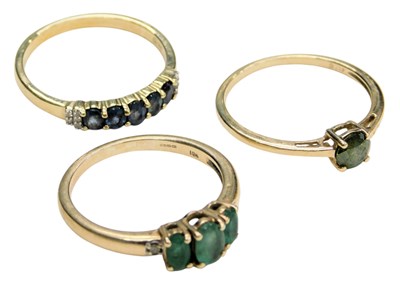 Lot 749 - Three 9ct gold and gem set rings, two with...