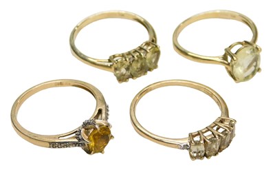 Lot 722 - Four 9ct gold and gem set rings, three set...