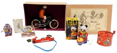 Lot 316 - Various tinplate toys, including an Amusing...