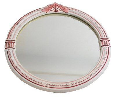 Lot 317 - A circular ceramic wall mirror, decorated with...