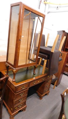 Lot 1517a - A walnut pedestal desk with green leather top,...