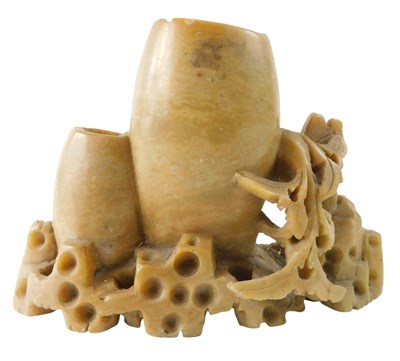Lot 376 - An Oriental soapstone brush pot, carved with...