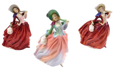 Lot 461 - Three Royal Doulton porcelain figurines...