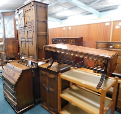 Lot 1620a - A mid-century oak writing desk, with four...