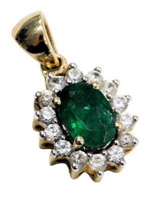 Lot 760 - An emerald and diamond pendant, set in 9ct...