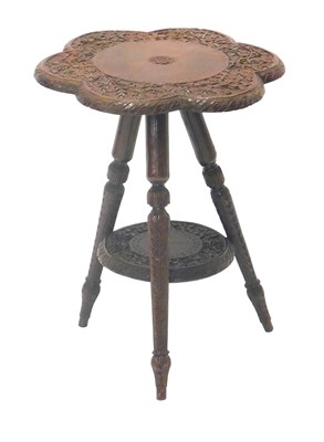 Lot 991 - A carved Indian occasional table, with flower...