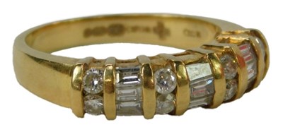 Lot 28 - An 18ct gold and diamond ring, with three rows...