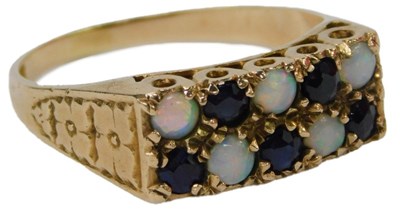 Lot 44 - A 9ct gold opal and sapphire ring, set with...