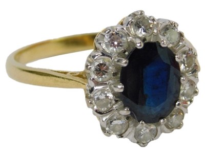 Lot 3 - An 18ct gold sapphire and diamond cluster ring,...