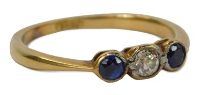 Lot 47 - A sapphire and diamond three stone ring, the...