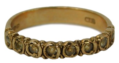Lot 49 - A 9ct gold and white stone half eternity...