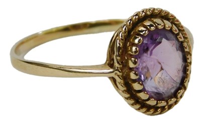 Lot 50 - A 9ct gold and amethyst ring, the oval...