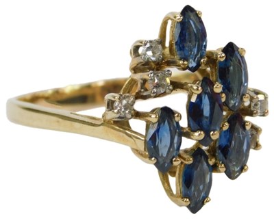 Lot 52 - A diamond and sapphire ring, the six marquise...