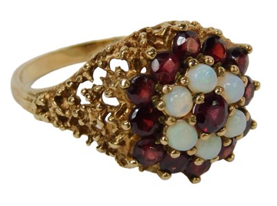 Lot 54 - A 9ct gold opal and garnet floral cluster ring,...