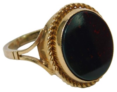 Lot 56 - A 9ct gold bloodstone ring, the oval...