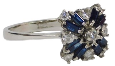 Lot 60 - A diamond and sapphire cluster ring, with...