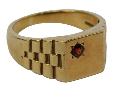 Lot 70 - A gentleman's signet ring, set with a garnet,...