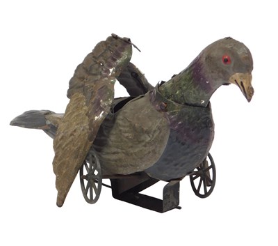Lot 737 - An early 20th clockwork tinplate pigeon, from...
