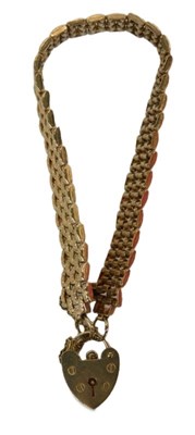 Lot 94 - A 9ct gold four-row bark effect bracelet, with...